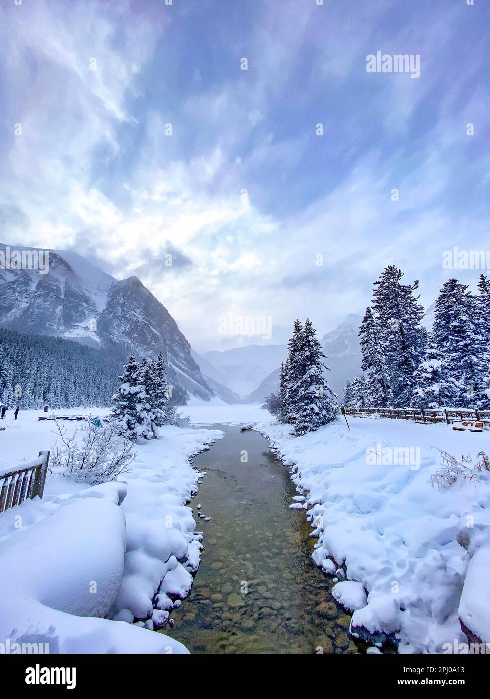 Stream in winter landscape at Chateau Lake Louise Hotel, Alberta, Canada Stock Photo