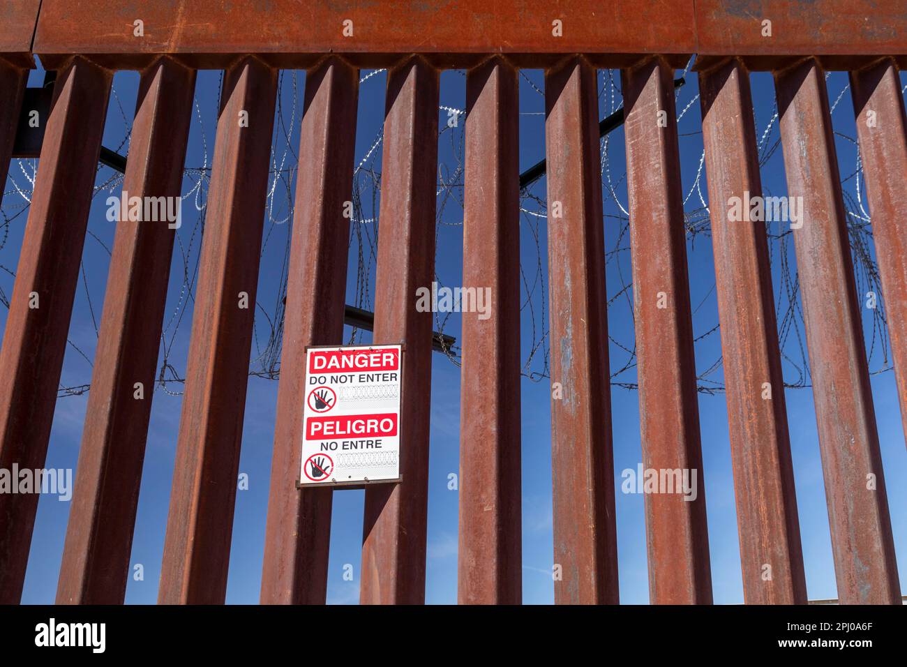 Agua Prieta, Mexico, The U.S.-Mexico border fence that divides Agua Prieta from Douglas, Arizona. A Do Not Enter sign and barbed wire adorn the fence Stock Photo