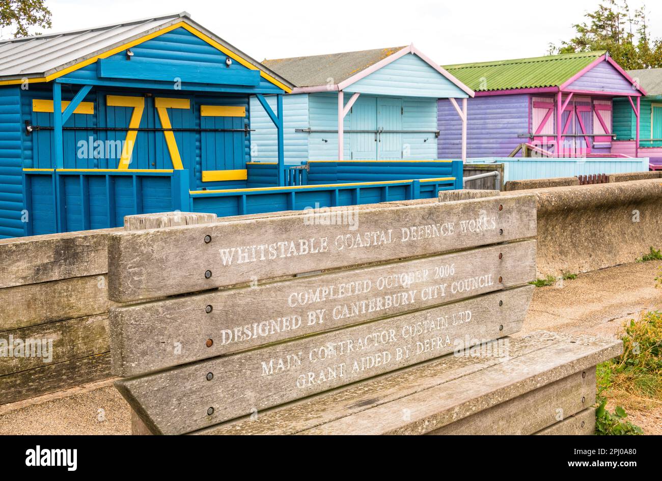 Coastal defence works and beach huts, Whitstable, Kent, England Stock Photo