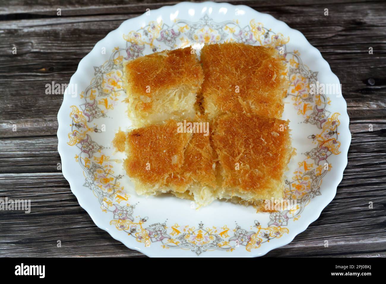 A traditional middle eastern dessert Knafeh Konafa made with spun ...