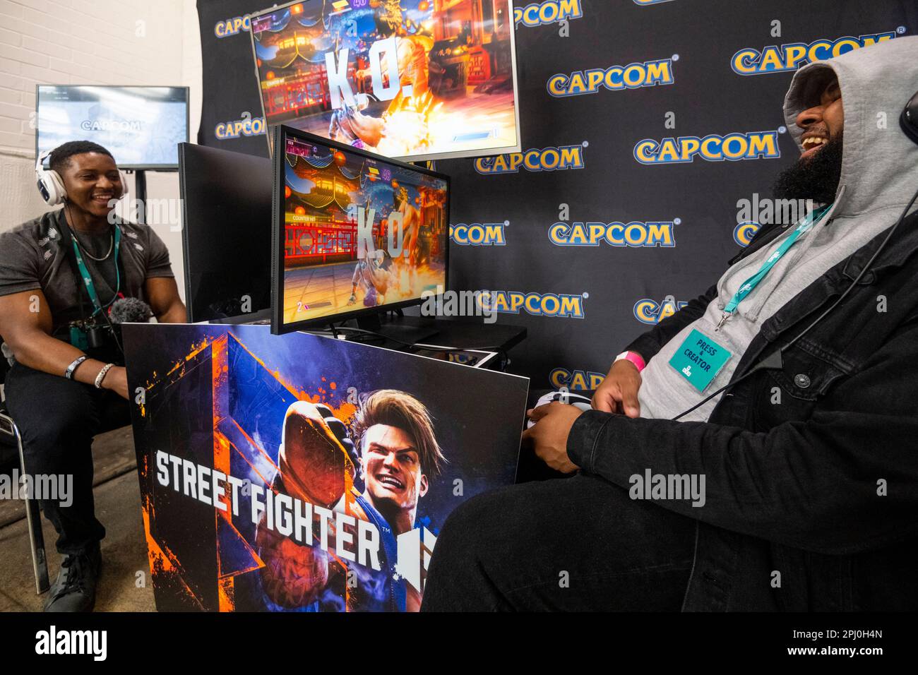 London, UK. 30 March 2023. Visitors play the upcoming 'Street Fighter 6 ...
