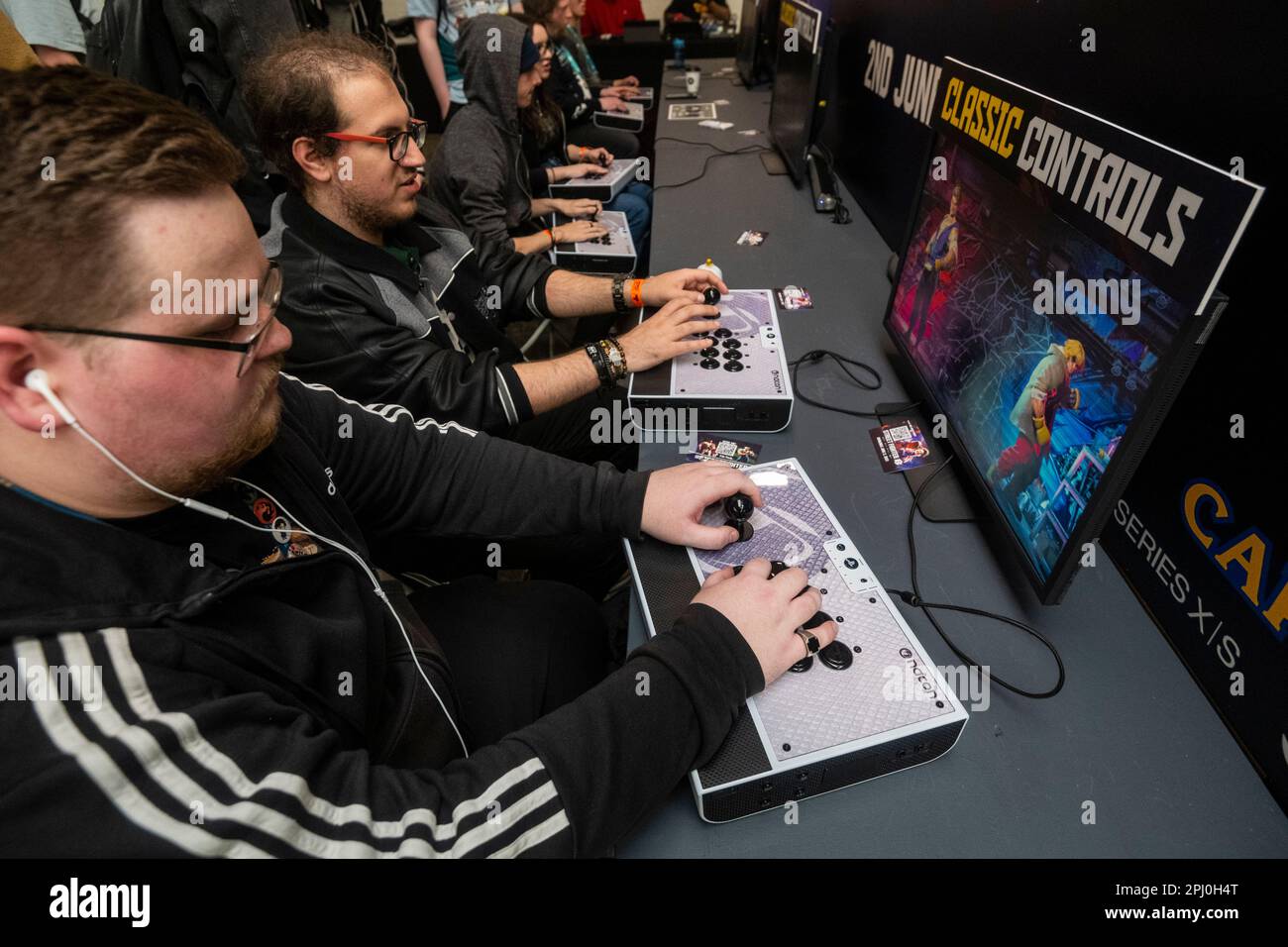 London, UK. 30 March 2023. Visitors play the upcoming 'Street Fighter 6 ...