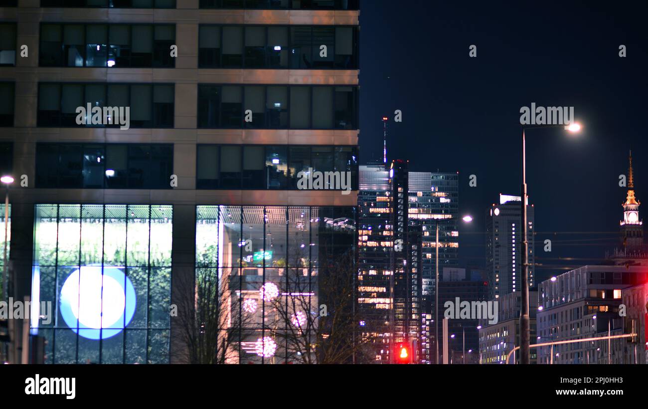 Pattern of office buildings windows illuminated at night. Glass ...