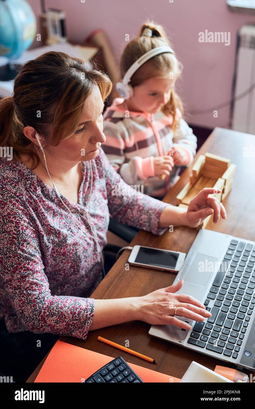 Woman mother working doing her job remotely during video chat call