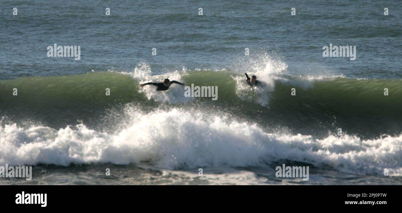 surf 166 ls.jpg Surfers ride the waves on Ocean Beach close to where Sloat  crosses the Great Highway. A surfer washes up on shore at Sloat at Great  Highway on Ocean Beach., image size:1300x690