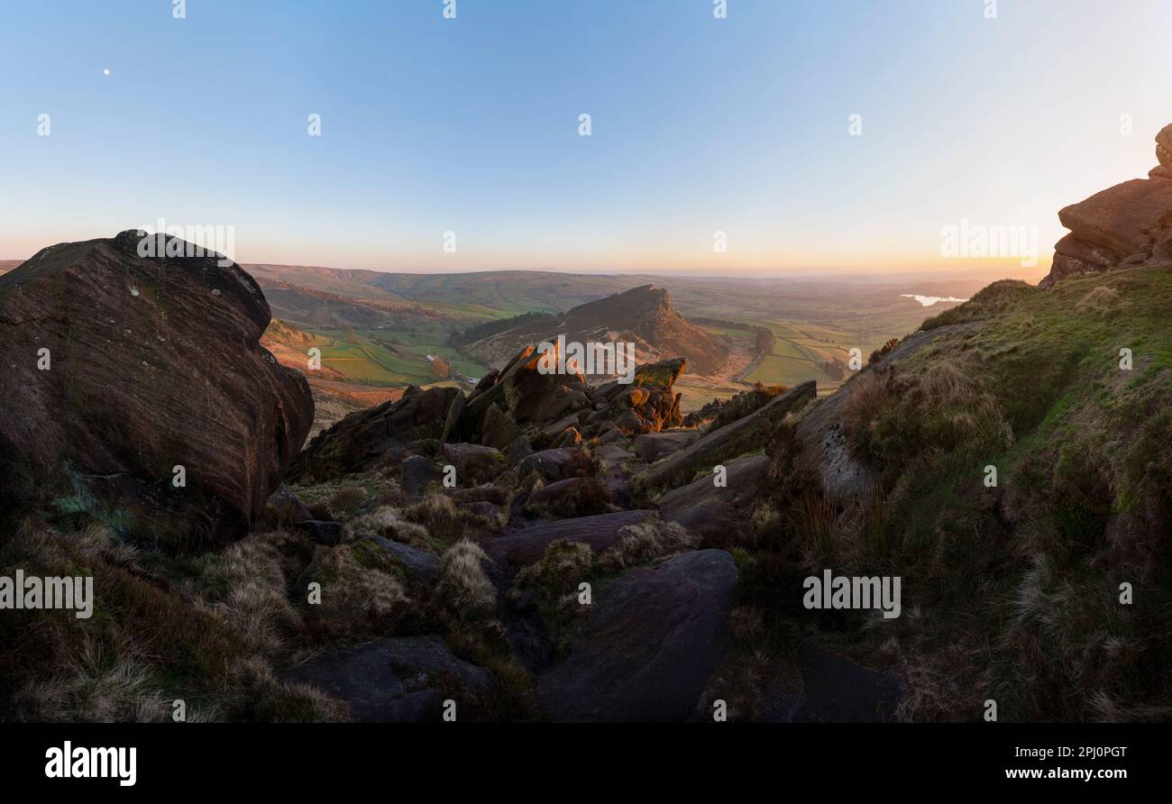Looking from the rocks on the Roaches towards the formation of Hens Cloud in the Staffordshire countryside in the English Peak District, at sunset Stock Photo