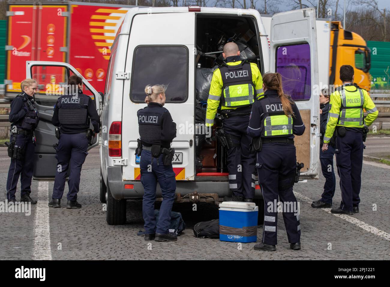 Aachen, Germany. 30th Mar, 2023. Several police officers search a white van. In the German-Dutch-Belgian border region near Aachen, there was a control action with officers from all three countries on Thursday. (to dpa: 'Control action in border region with police from Belgium and Holland') Credit: Ralf Roeger/dpa/Alamy Live News Stock Photo