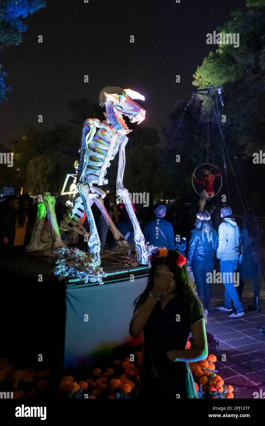 Halloween in Mexico City. People looking at Dia de muertos sculptures