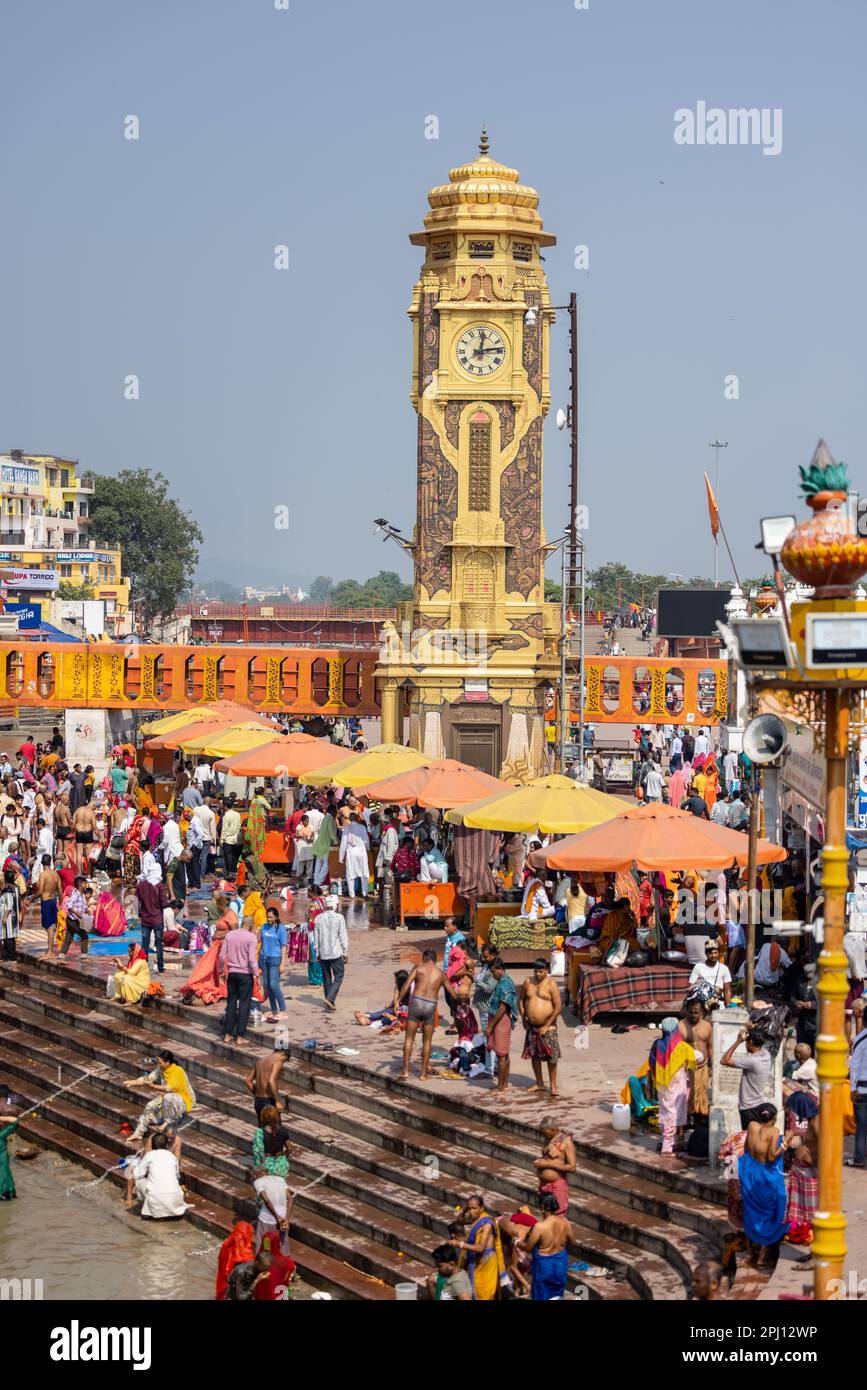 Clock tower, Architectural view of clock tower at main bathing ghat near back of river ganges in haridwar. People around the world take holy dip. Stock Photo