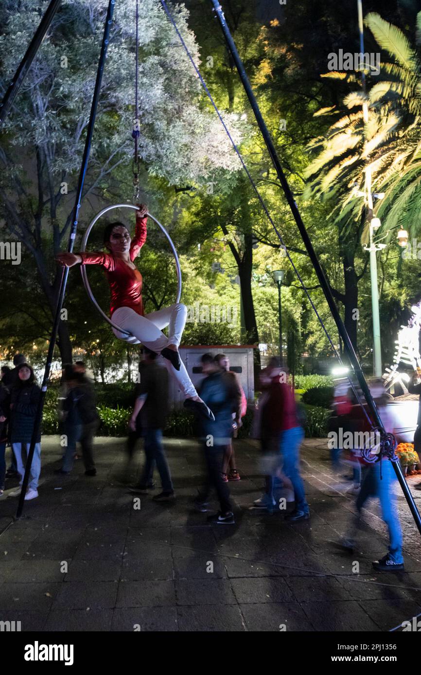 Halloween in Mexico City. People looking at Dia de muertos sculptures