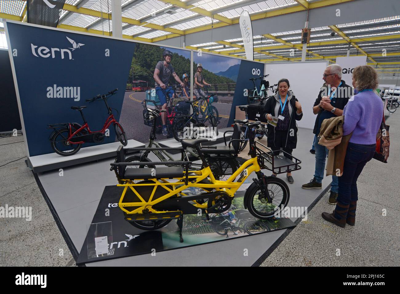 People looking at Tern electric assist load carrying cargo bikes on