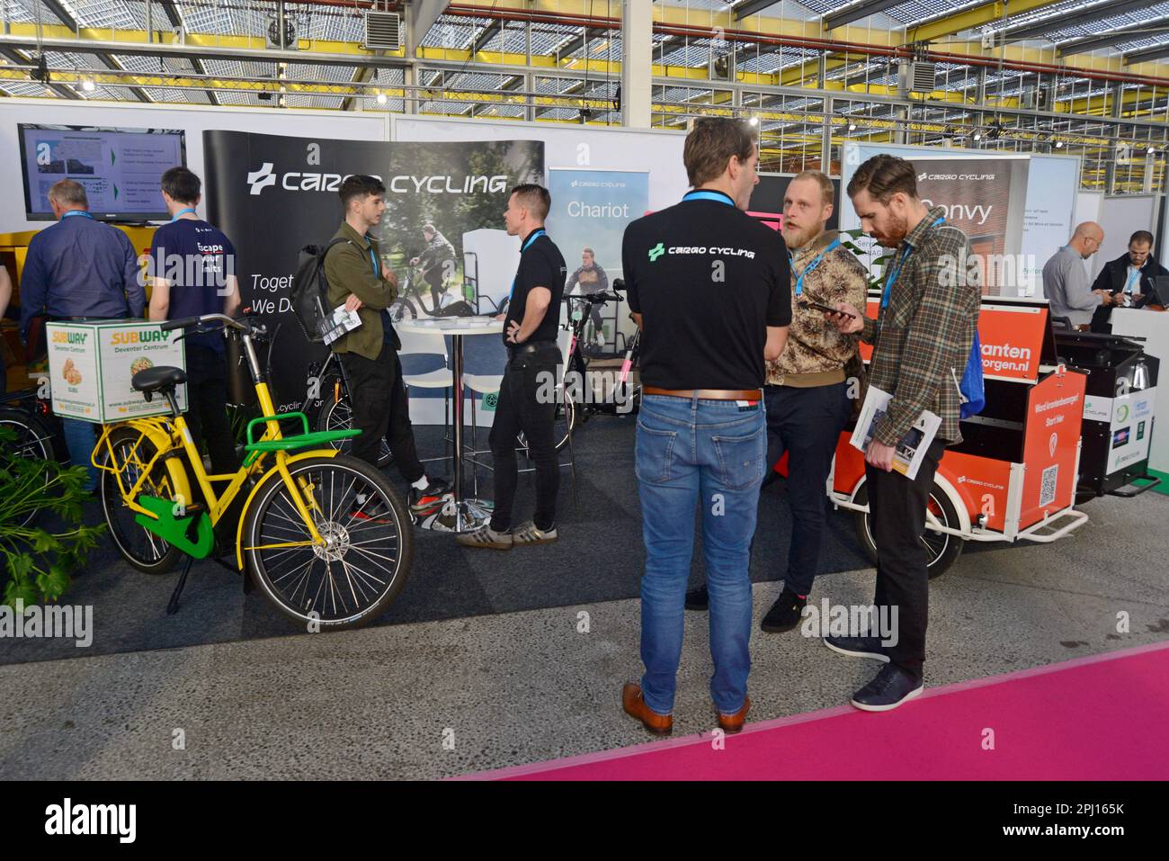 People looking at Cargo Cycling delivery bikes and e bicycles on