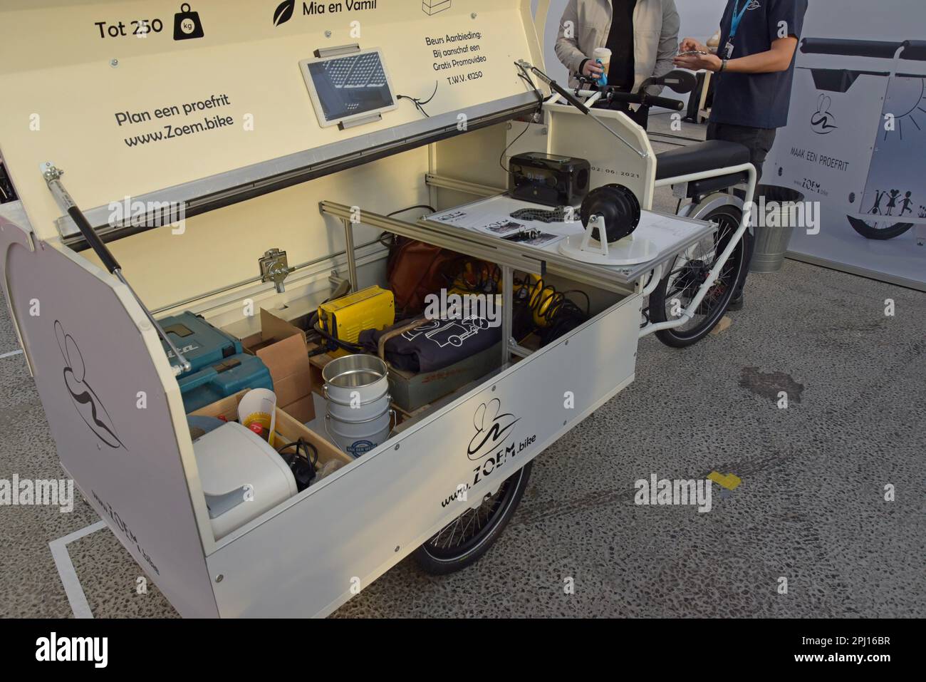 Zoem electric assist load carrying trike with solar power for tradesmen on display at the World of E Mobility show, Haarlem, Netherlands, Nov 2022 Stock Photo
