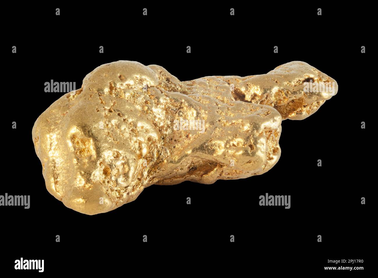 Gold nugget, from Carisbrook Australia, on solid black background. Stock Photo