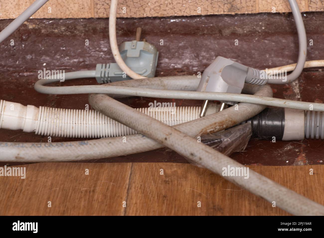 electric wires and drain hoses are on the old dirty floor Stock Photo Alamy