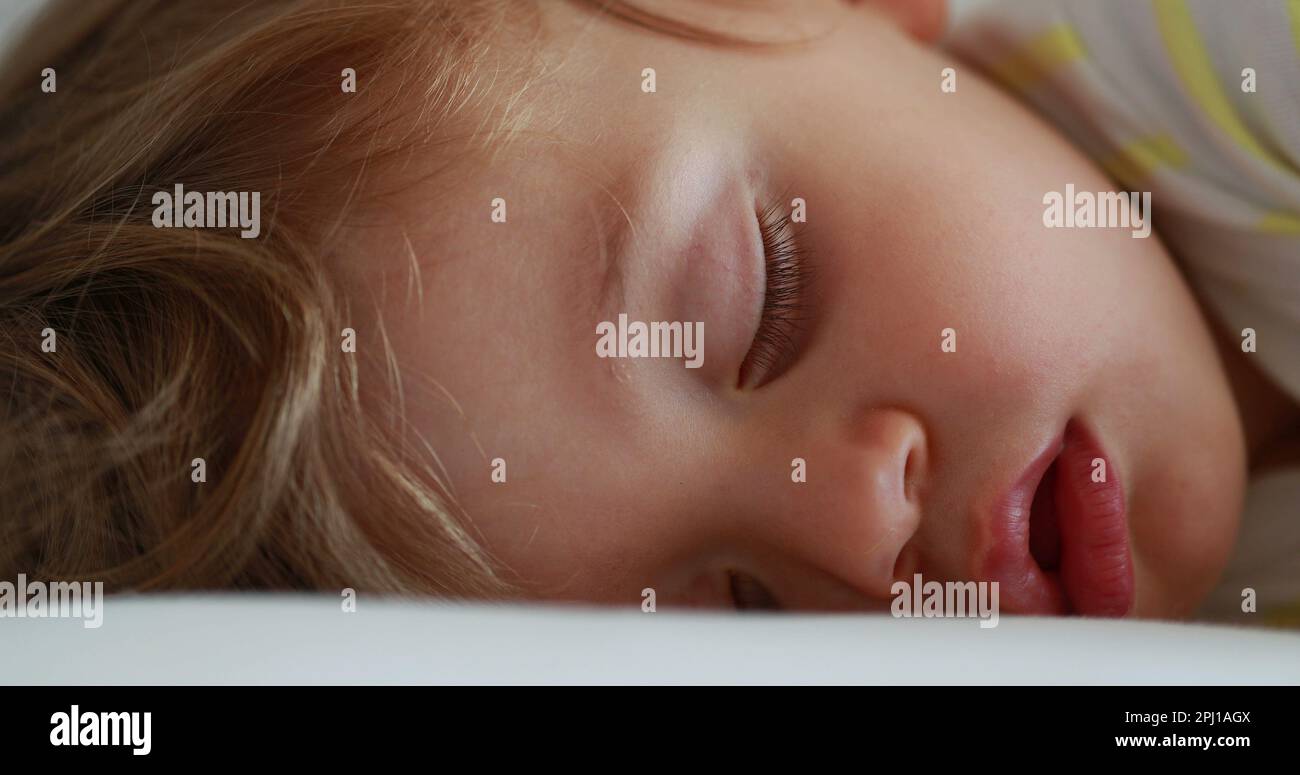 One year old baby sleeping drooling. Napping infant todlder boy Stock