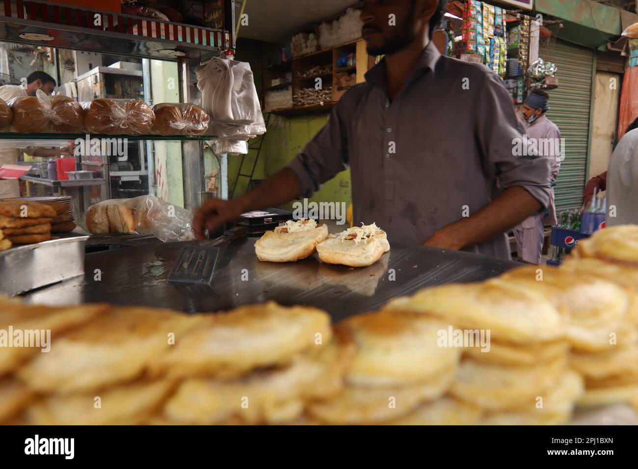 Burns Road march 2021, A young man making Bun Kebab at famous and old
