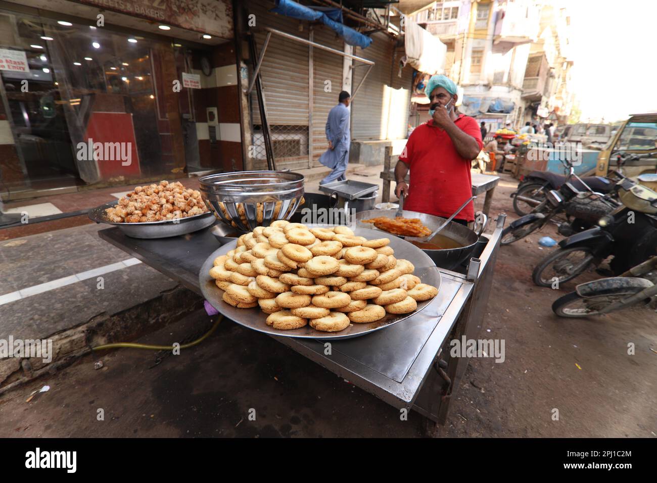 Burns Road march 2021,Man making fried sweets famous and old food
