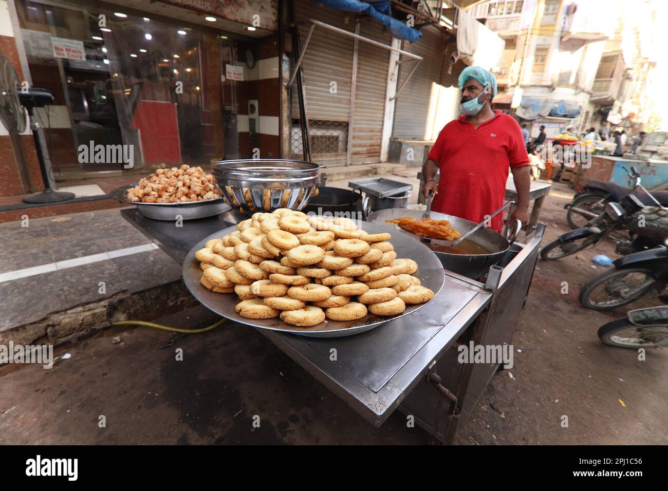 Burns Road march 2021,Man making fried sweets famous and old food