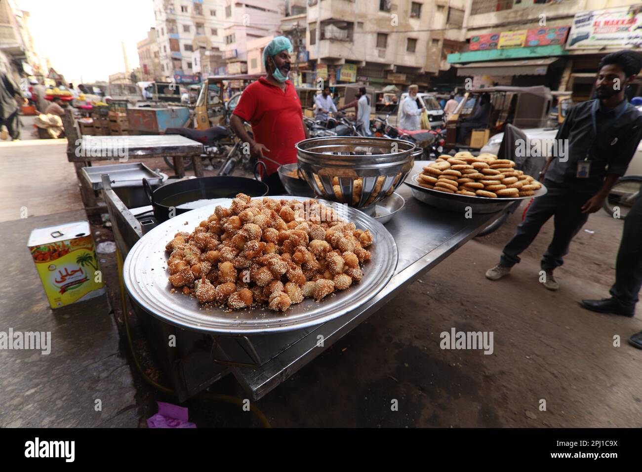 Burns Road march 2021,Man making fried sweets famous and old food