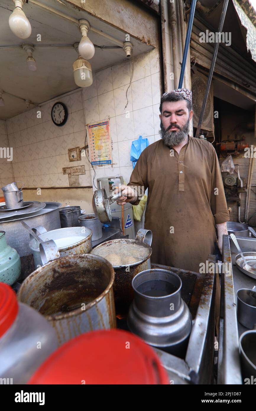 Karachi Pakistan march 2021, man making tea at famous and old food
