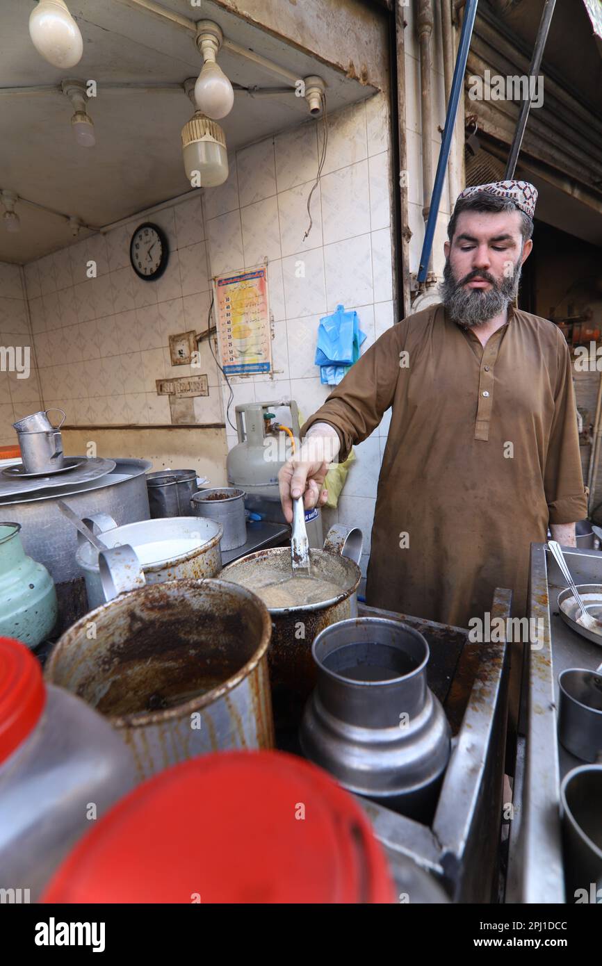 Karachi Pakistan march 2021, man making tea at famous and old food
