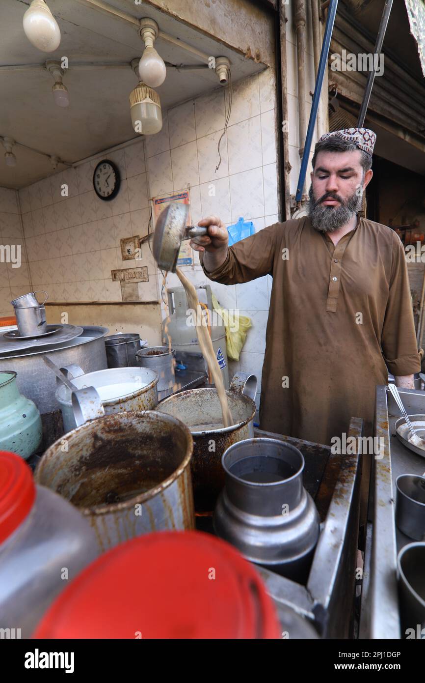 Karachi Pakistan march 2021, man making tea at famous and old food street of Karachi,Midsection