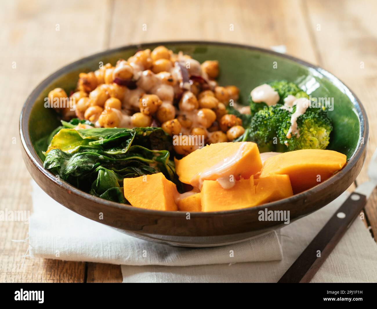 Broccoli Buddha bowl with sweet potato, spinach, spiced chickpeas and a