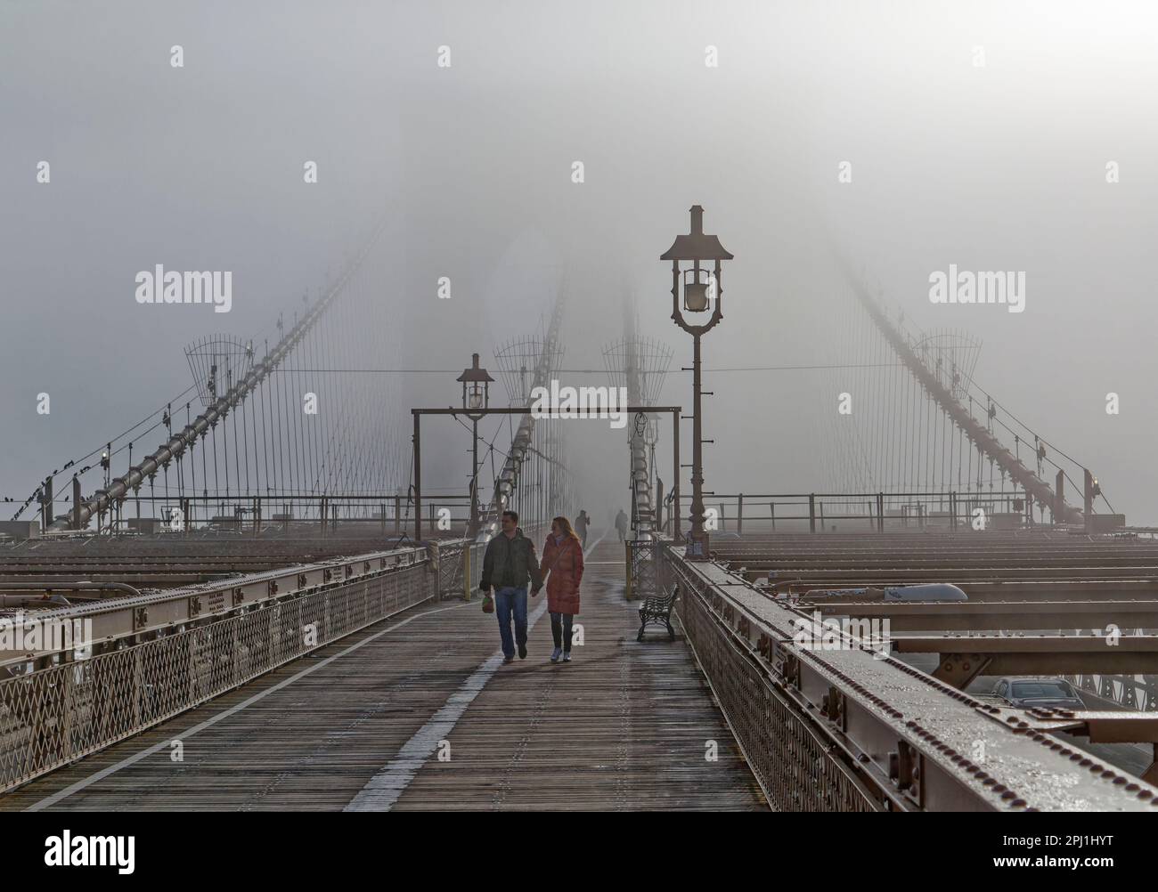 Brooklyn Bridge’s famous gothic towers are shrouded in a January fog