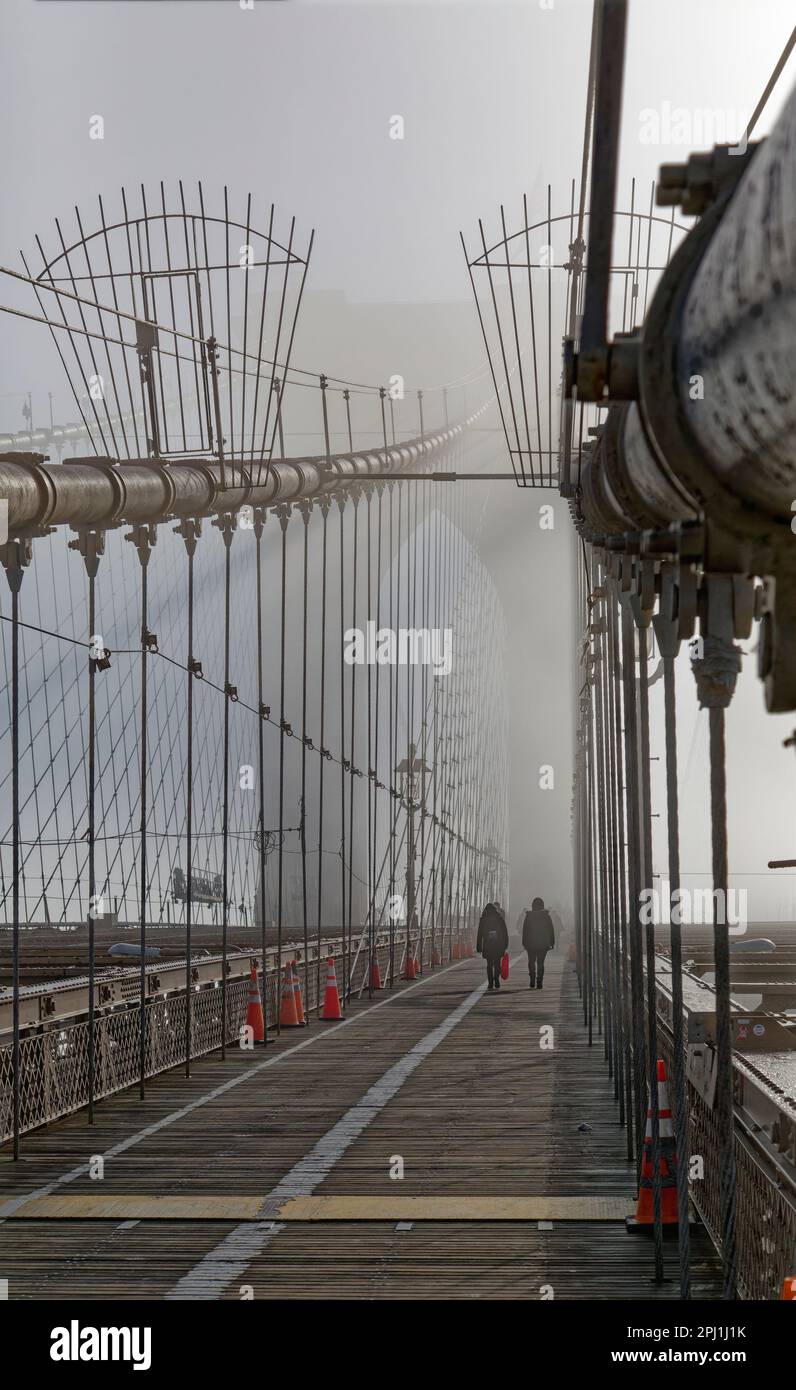 Brooklyn Bridge’s famous gothic towers are shrouded in a January fog
