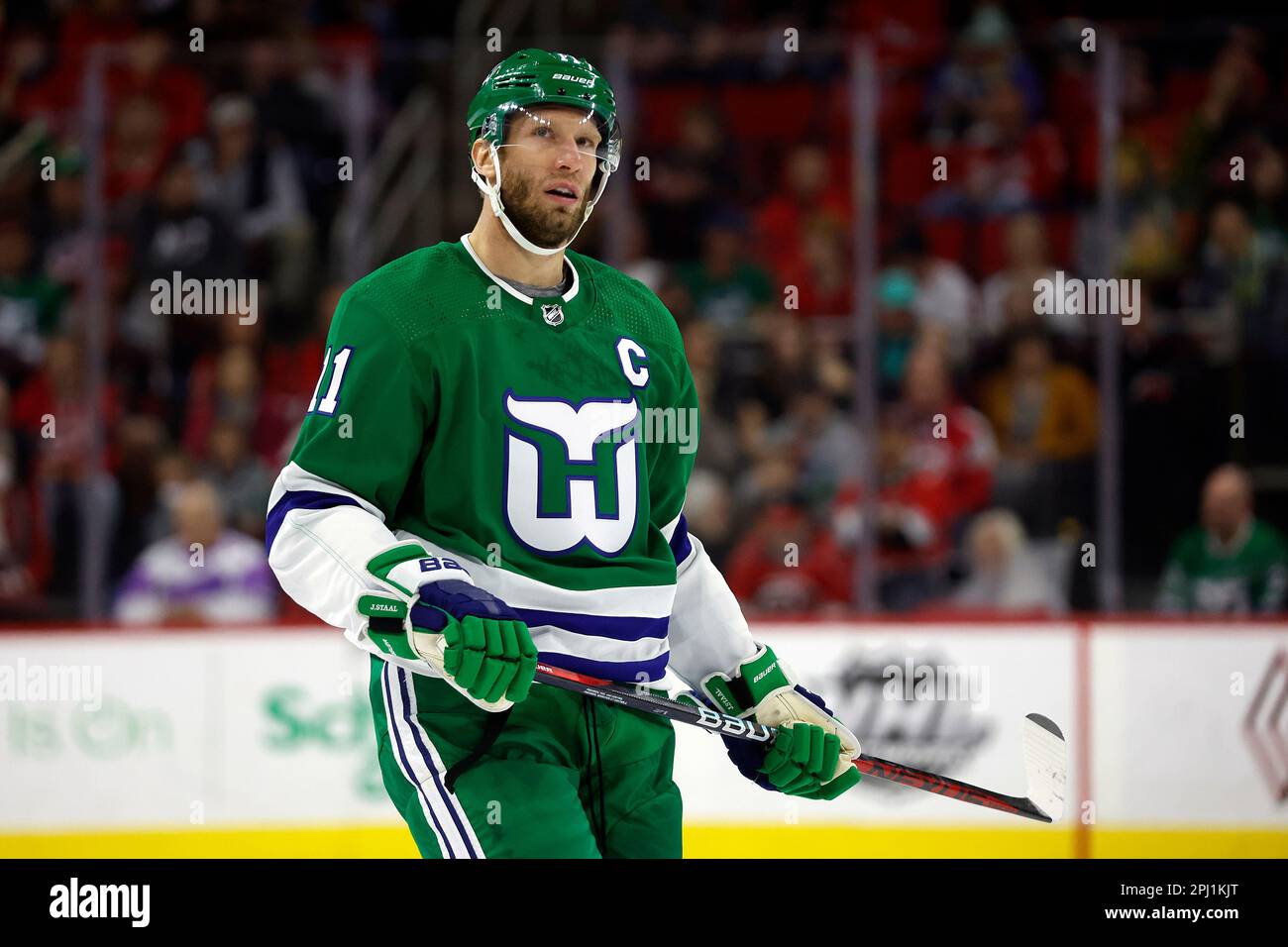 Carolina Hurricanes Jordan Staal (11) watches a replay on the scoreboard during the first period of an NHL hockey game against the Boston Bruins in Raleigh, N.C., Sunday, March 26, 2023