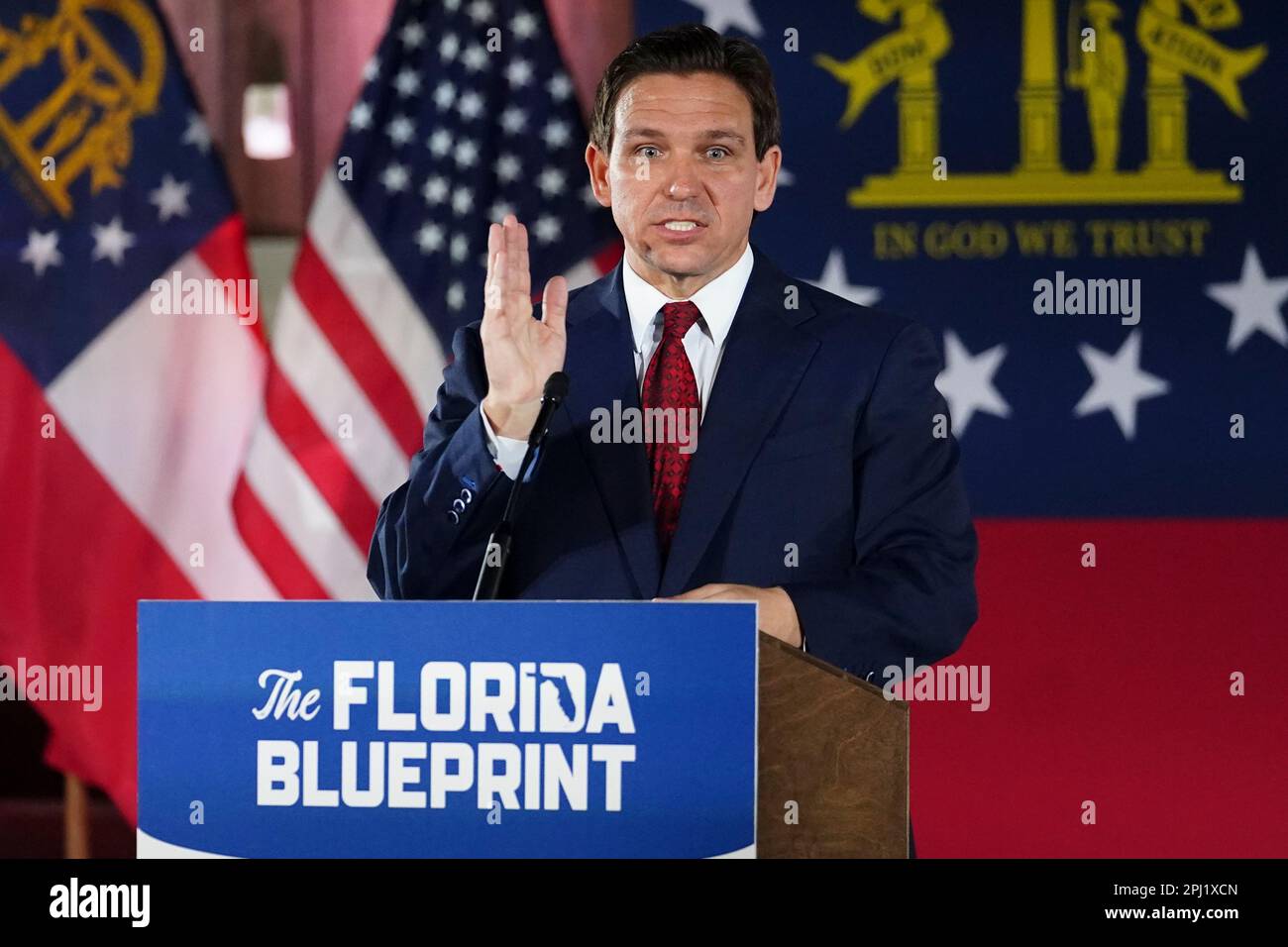 Florida Gov. Ron DeSantis speaks to a crowd at Adventure Outdoors gun