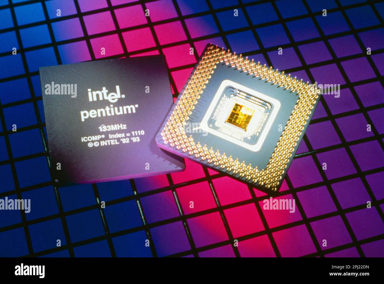 Old Intel Pentium Processing Chip 133MHz on Colourful Background Stock Photo