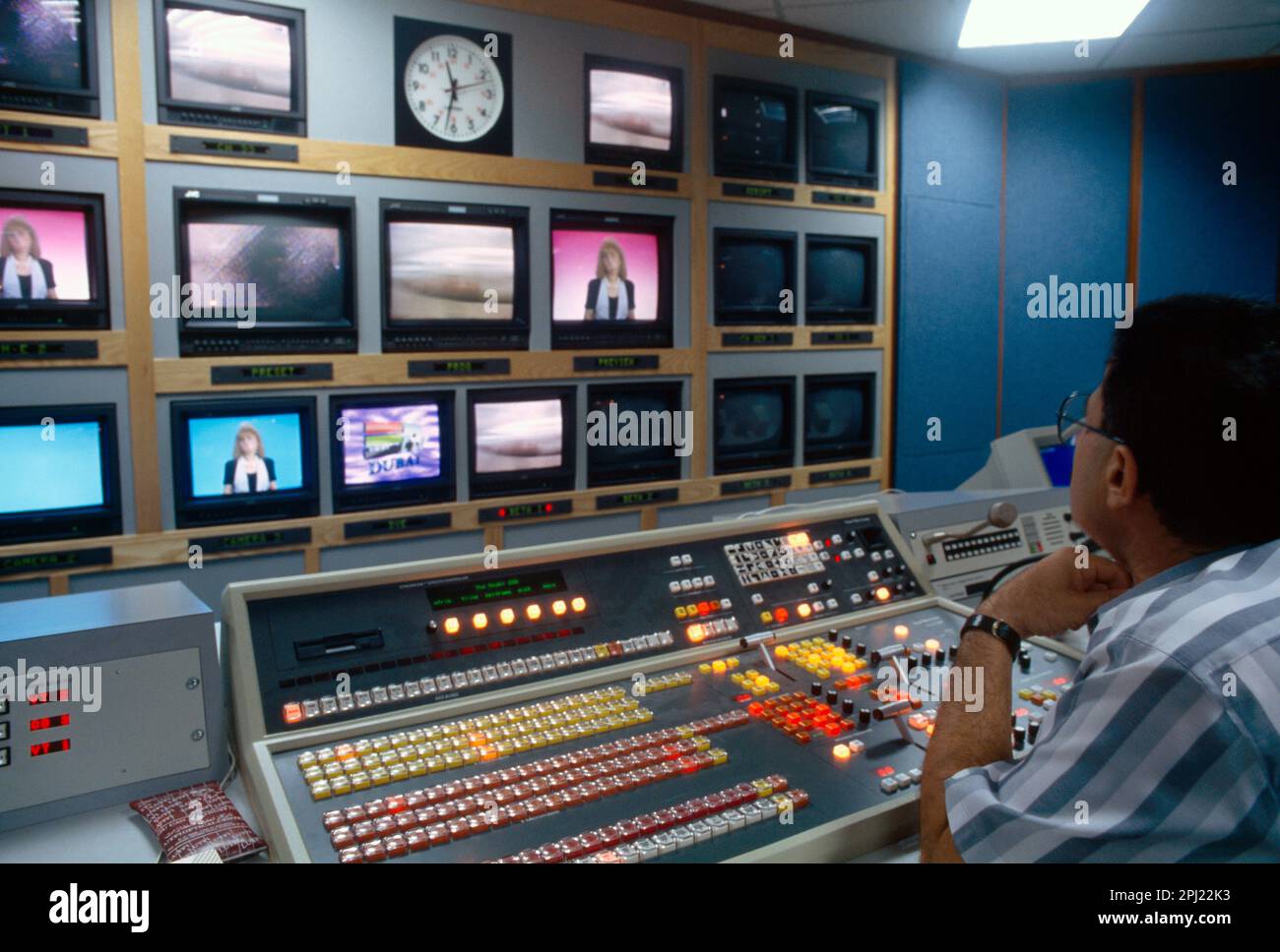 Dubai UAE Man Working in Satellite Television Control Room Stock Photo