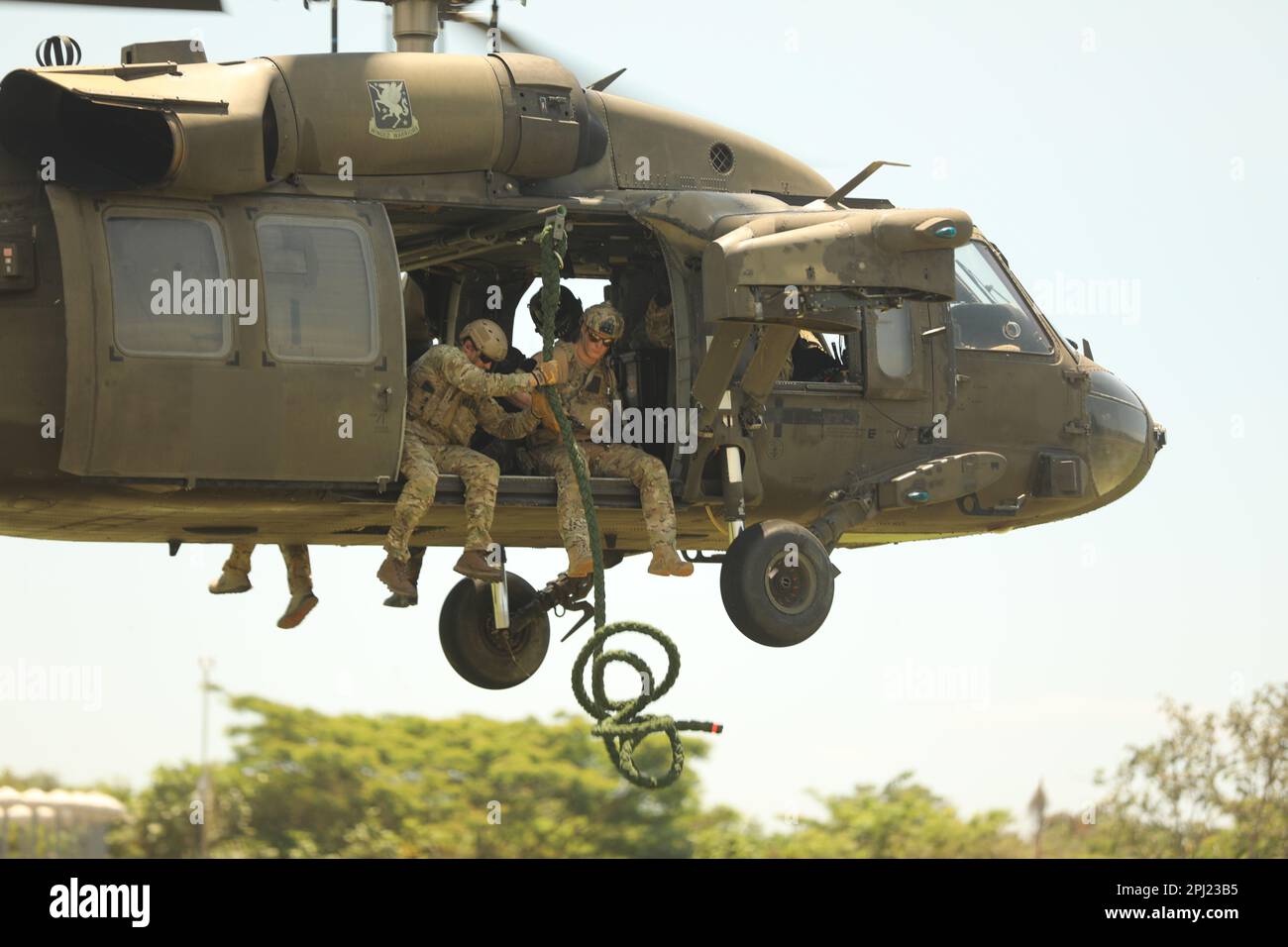 Navy SEALs drop fast rope from a UH60 Blackhawk with 1-228th Aviation  Regiment for FRIES training during CENTAM Guardian 23 in San Jose,  Guatemala on March 21, 2023. CG23 is an annual
