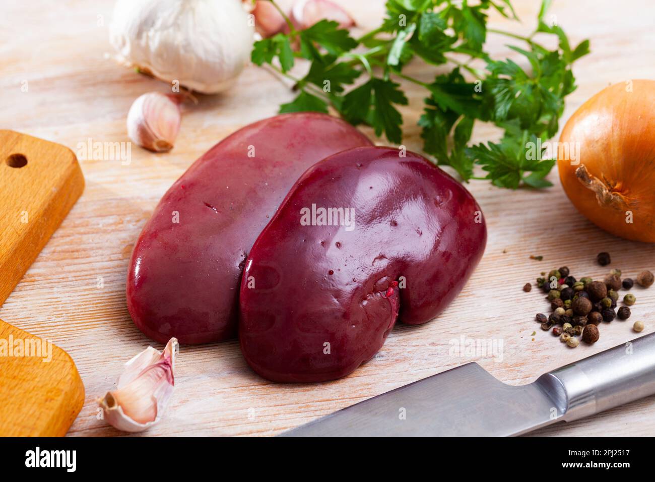 Raw pork kidneys with seasonings Stock Photo Alamy