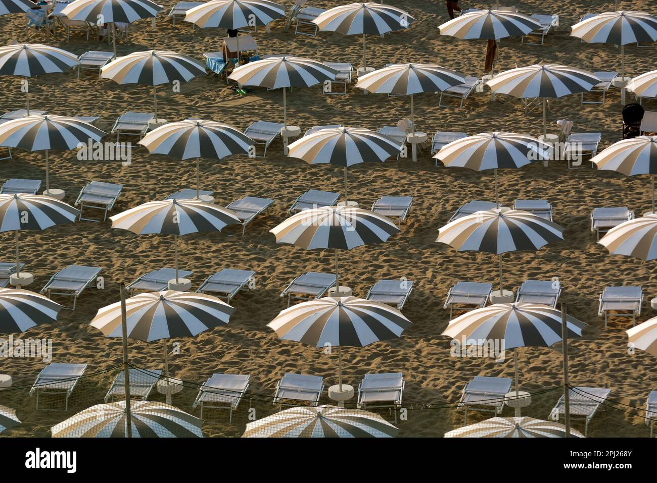 Umbrellas on a sand beach Stock Photo - Alamy
