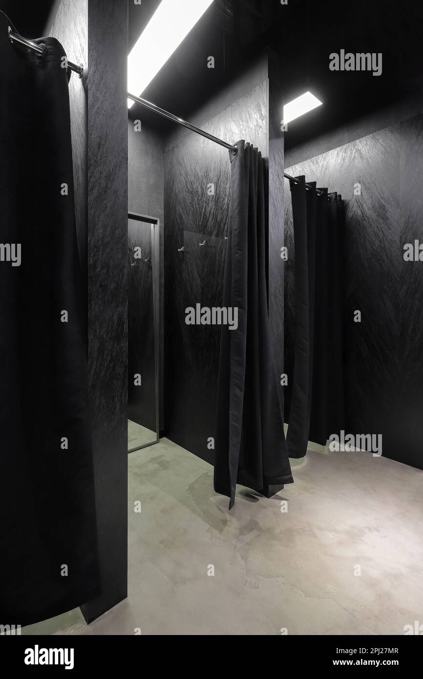 Black fitting room interior in the clothes shop Stock Photo