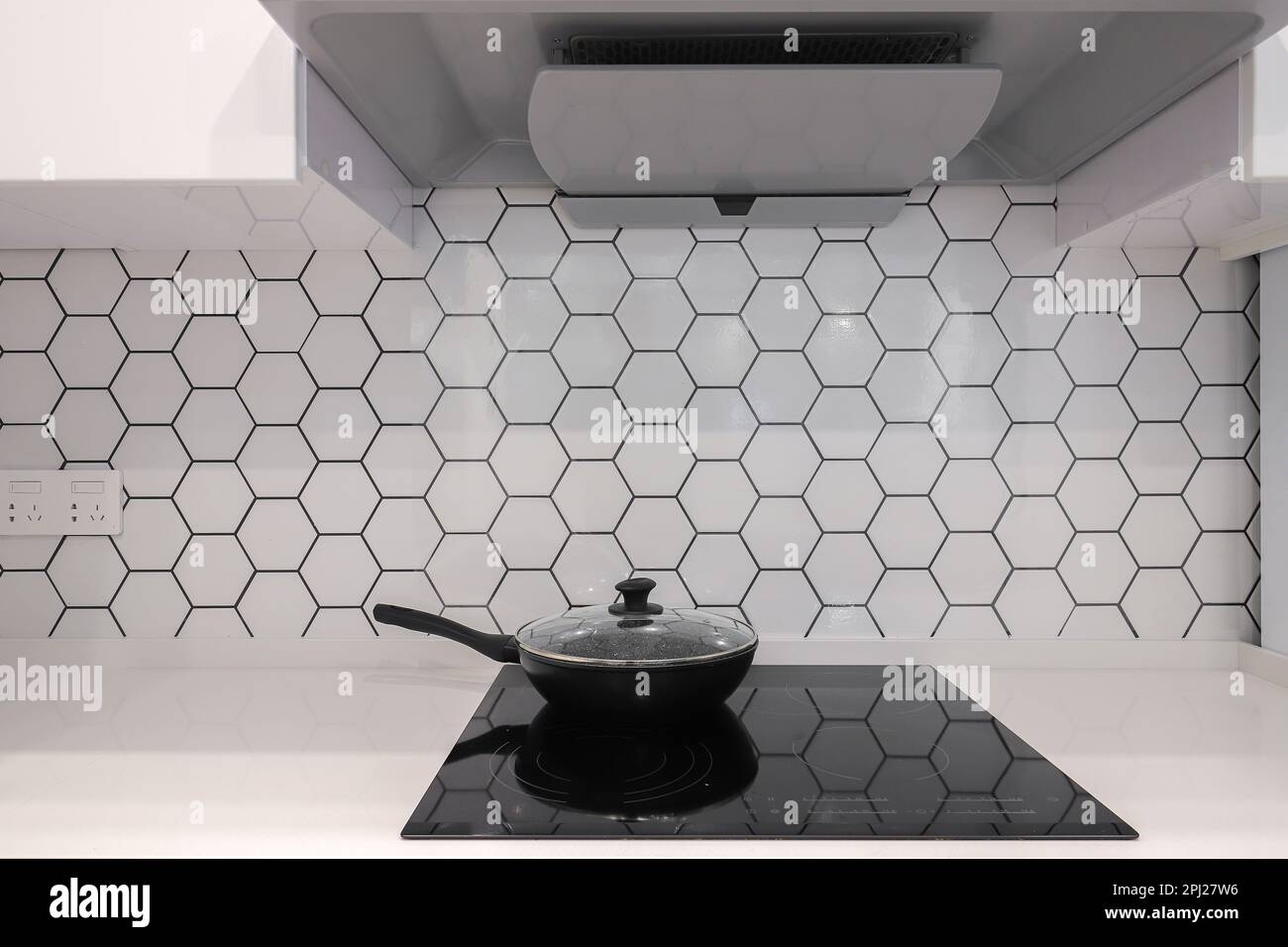 Frying pan on electric stove in the kitchen Stock Photo Alamy