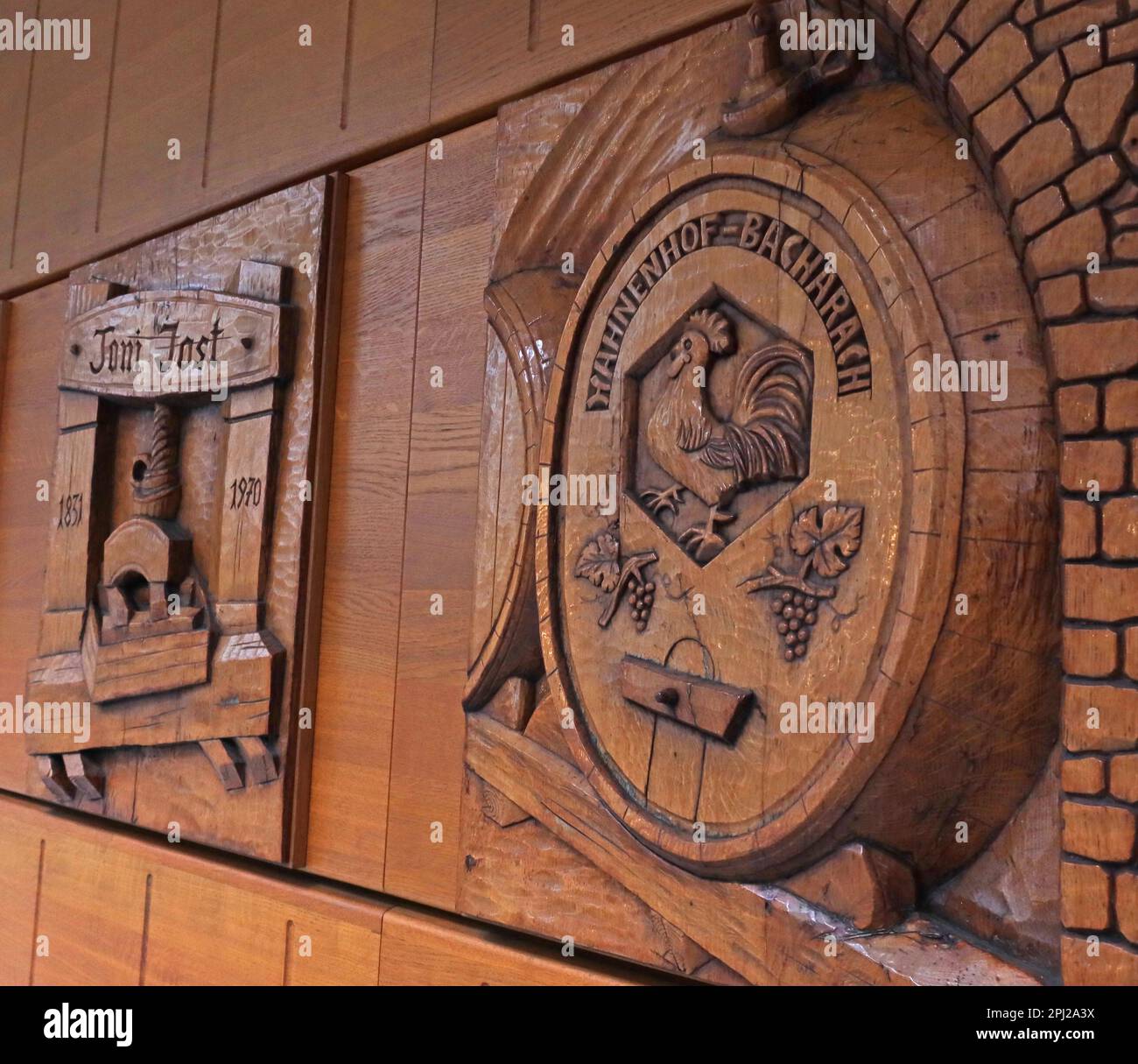 Wooden carvings, Toni Jost vineyard, winery 1831-1970, Bacharach (Bacharach am Rhein), Mainz-Bingen district, Germany Stock Photo