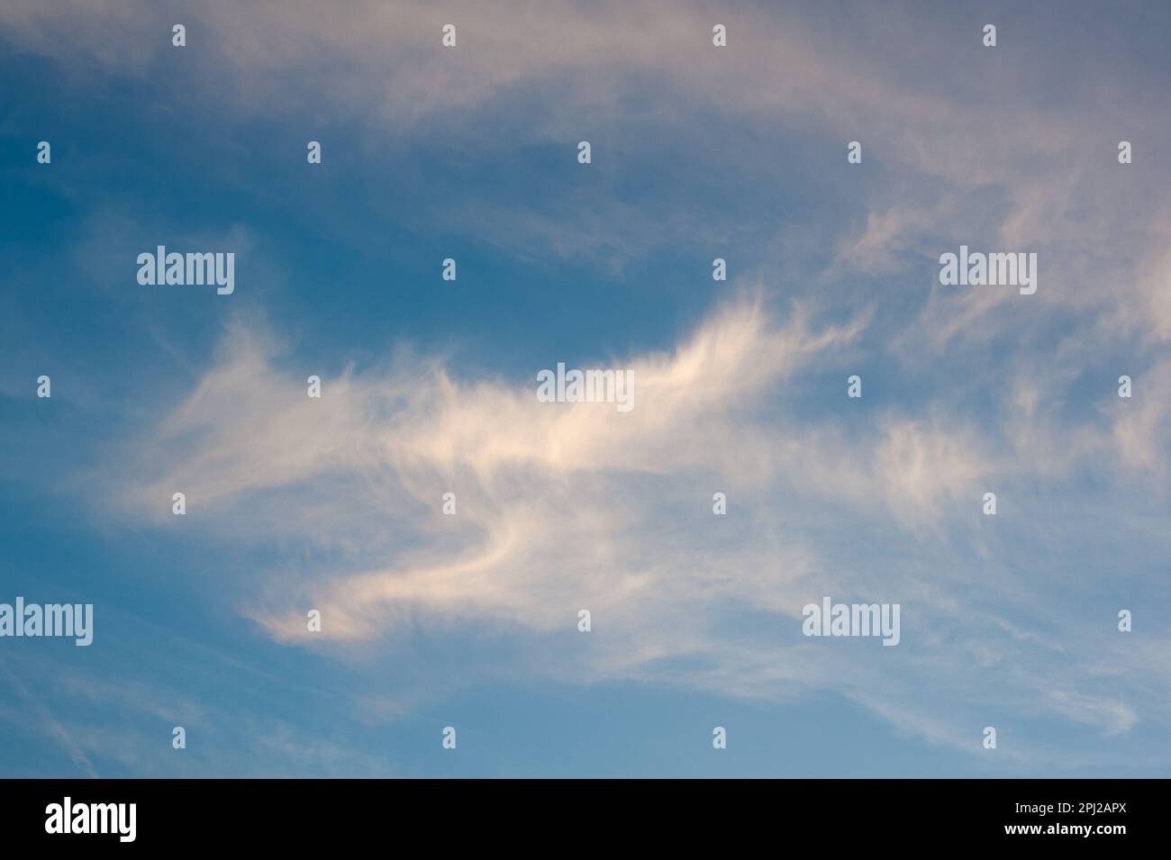 Wispy Cirrus clouds in deep blue sky Stock Photo - Alamy