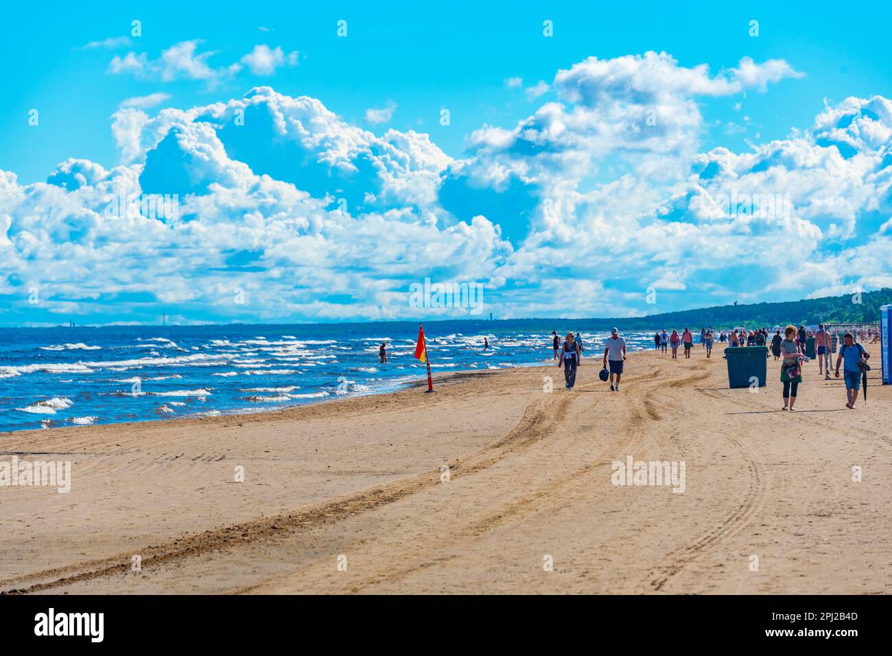 Jurmala, Latvia, July 9, 2022: People are enjoying a sunny day at beach in Jurmala, Latvia. Stock Photo