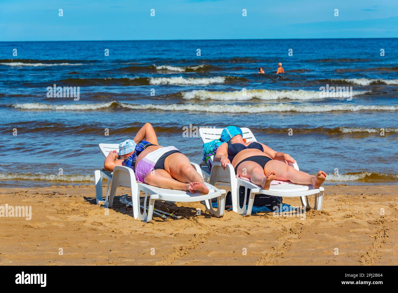 Jurmala, Latvia, July 9, 2022: People are enjoying a sunny day at beach in Jurmala, Latvia. Stock Photo