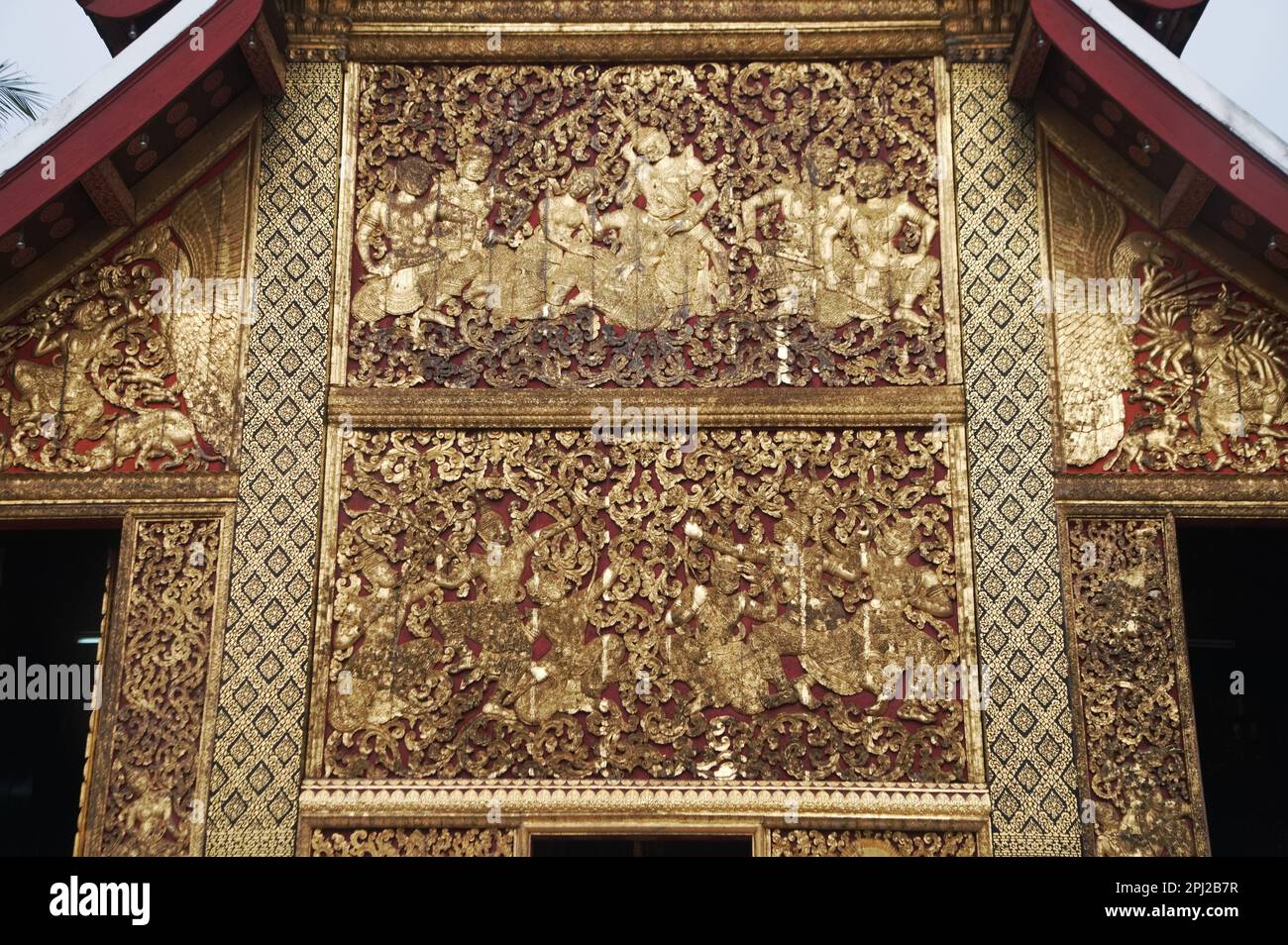 The exterior side walls are covered with sculpted and gilded teakwood