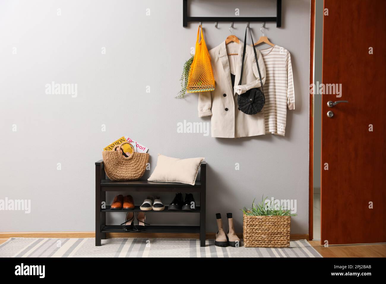 Hallway interior with stylish furniture, clothes and accessories Stock ...