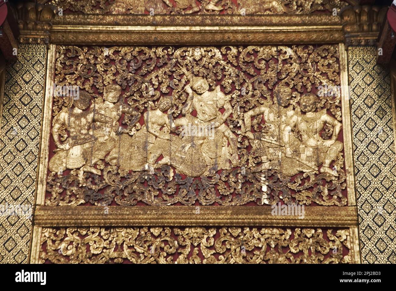 The exterior side walls are covered with sculpted and gilded teakwood