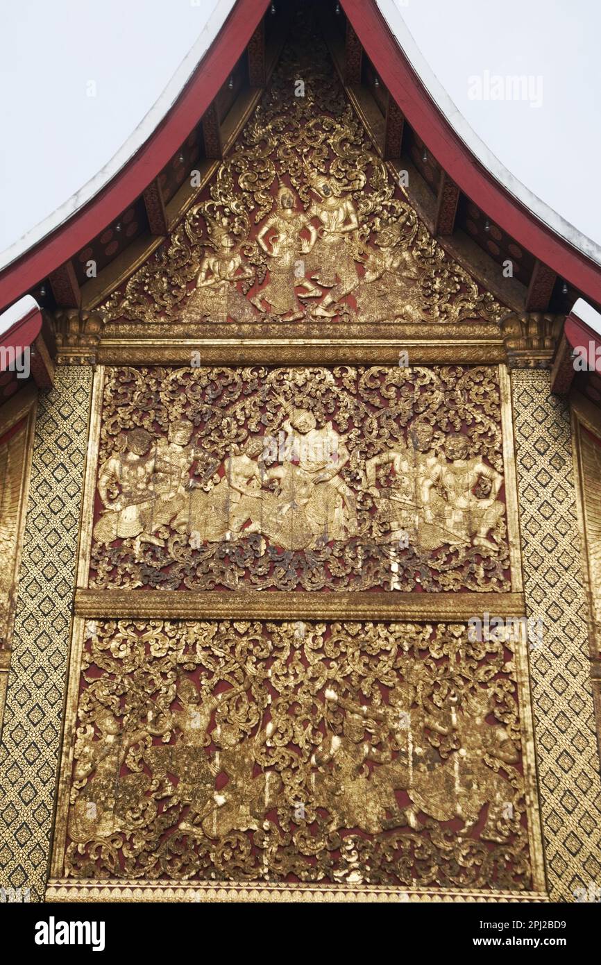 The exterior side walls are covered with sculpted and gilded teakwood