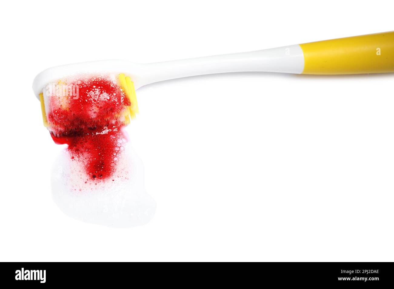 Toothbrush with paste and blood on white background. Gum inflammation Stock Photo