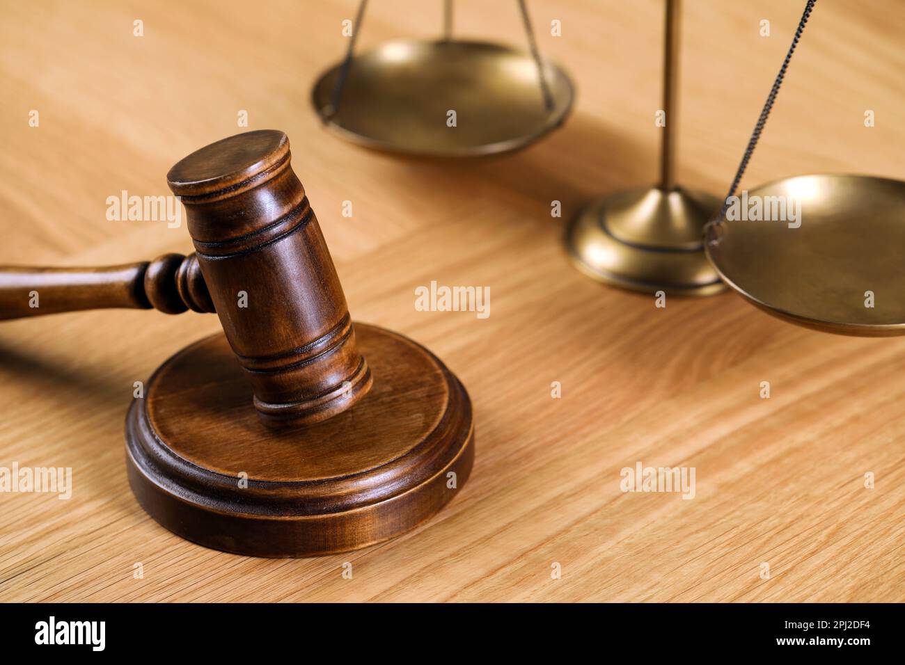 Wooden gavel and scales of justice on table. Space for text Stock Photo ...