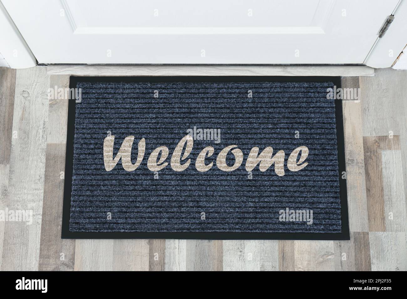 Door mat with word near entrance, top view Stock Photo Alamy